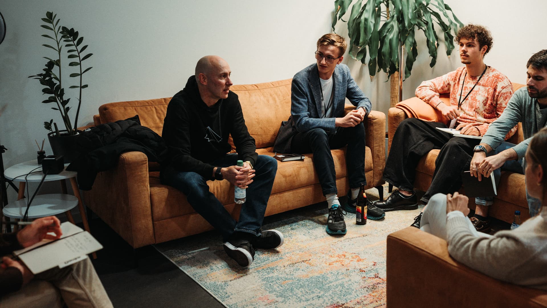 Builders talking on a sofa